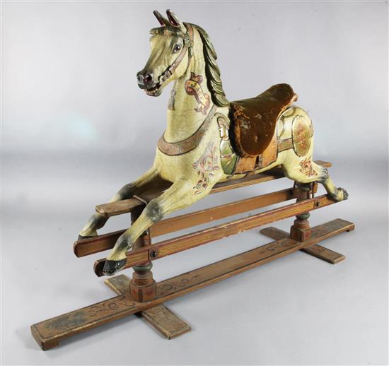 Orton & Spooner. A carved and painted wood carousel horse Jack, H.4ft 5in. Overall L.7ft 4in.